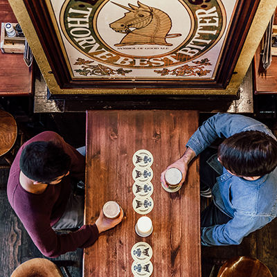 Two guys drinking a beer