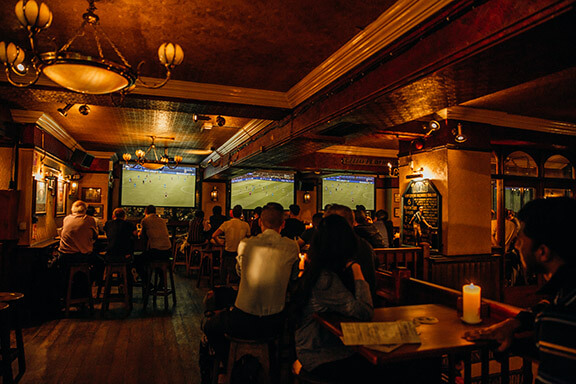 Big screens showing football